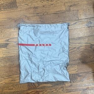 Prada Gray Bag with Red Logo Accent